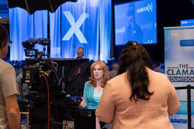 Liz Claman hosts her show from the humanx show floor at humanx