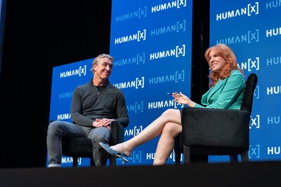 a moderator hosts a center stage interview at humanx