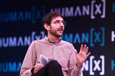 a moderator on center stage at humanx