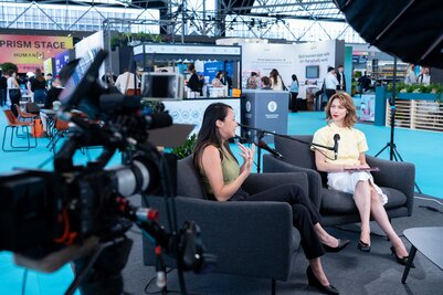 a journalist interviews a speaker in the interview room at humanx