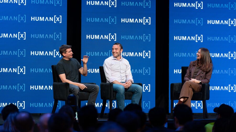 Jeff Seibert, Kevin Weil, and Kate Rooney on center stage at HumanX 2025