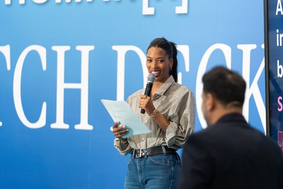 Main stage attendees smile during a session at HumanX 2026 San Francisco