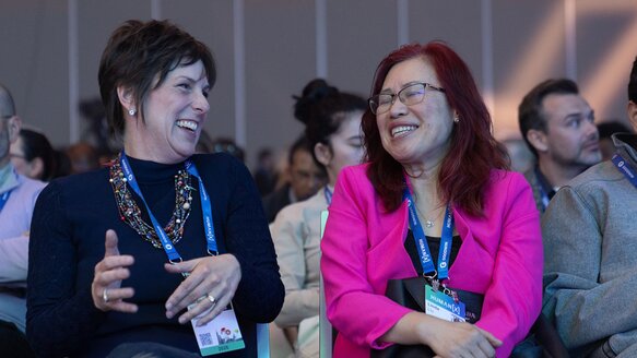 Audience members smile during a main stage session at HumanX San Francisco 2026