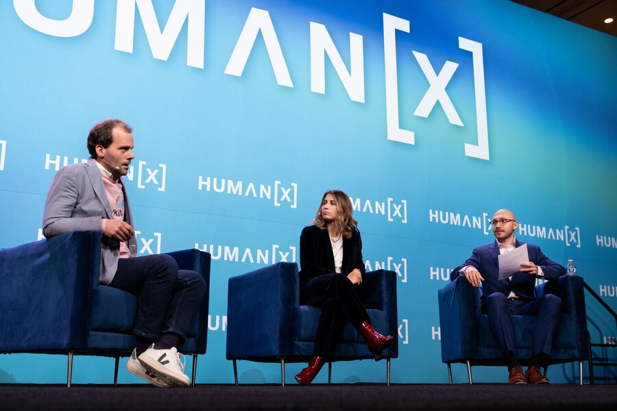 Speakers on a track stage at humanx 2025