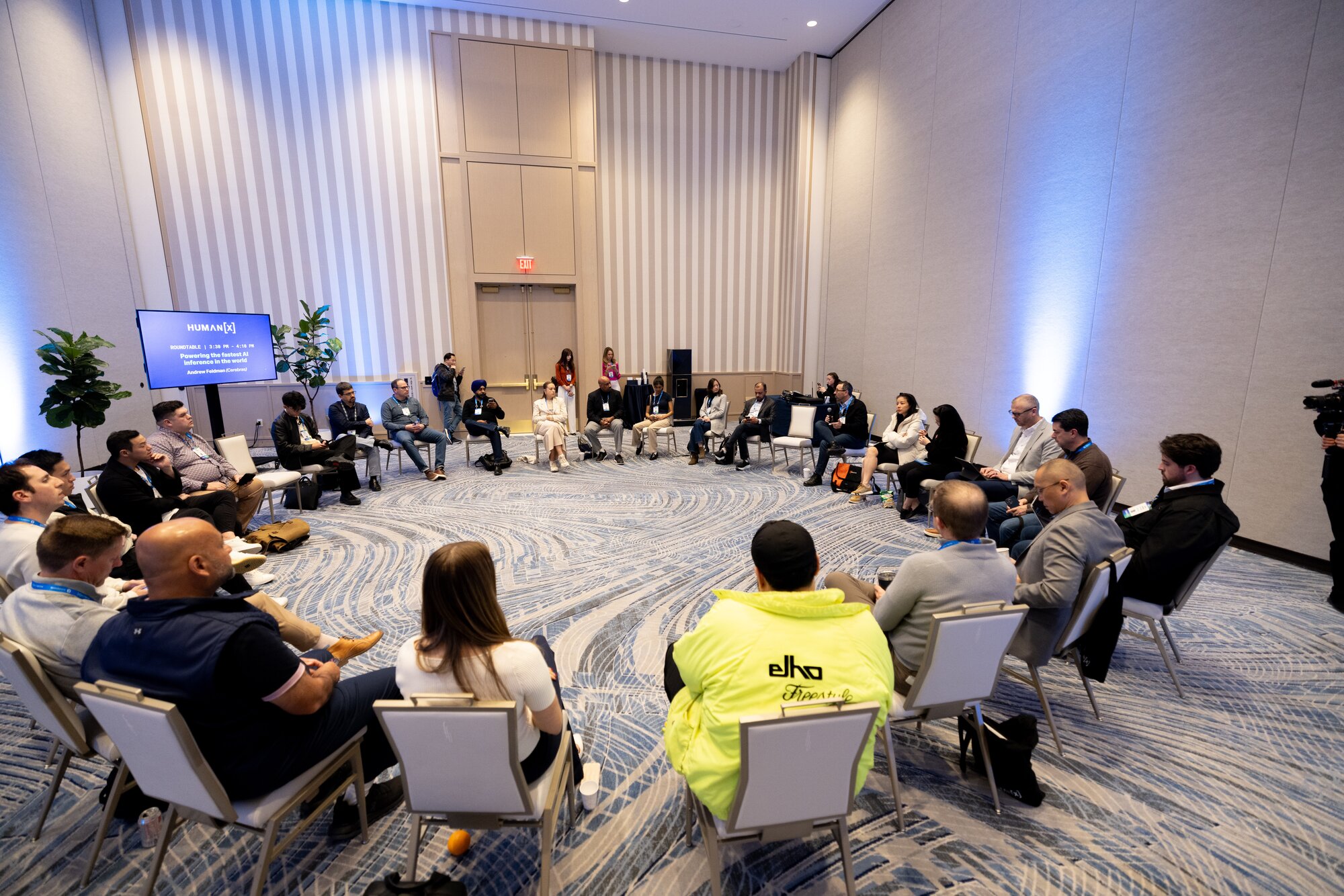 HumanX 2025 attendees sit in a circle formation during an intimate interactive session