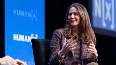 a moderator on center stage at humanx