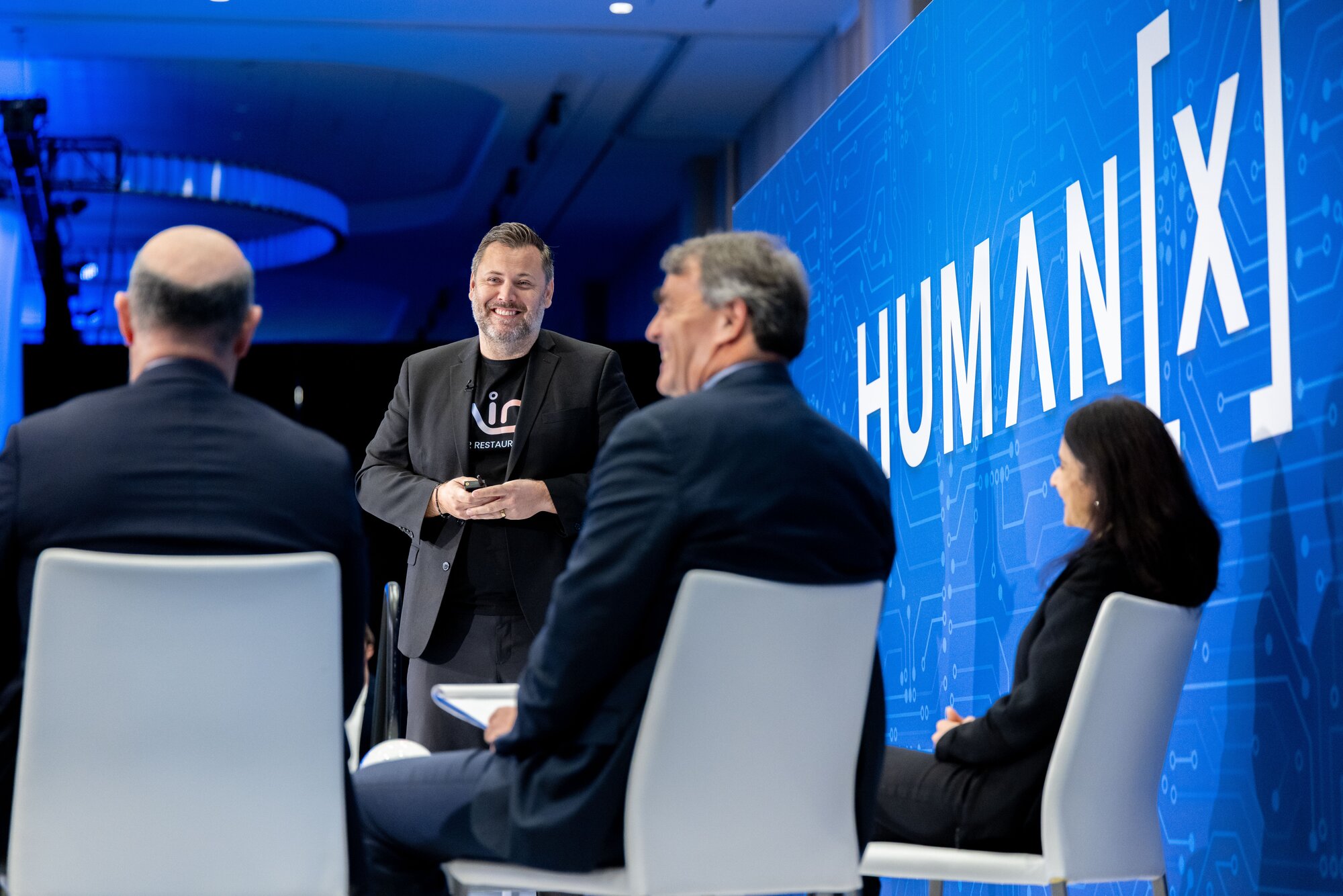 A man makes his pitch to a panel of judges at the 2025 HumanX startup stage