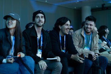 Main stage attendees smile during a session at HumanX 2026 San Francisco