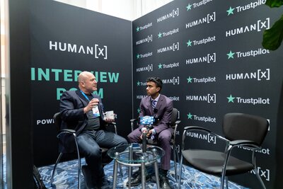 a journalist interviews a speaker in the interview room at humanx