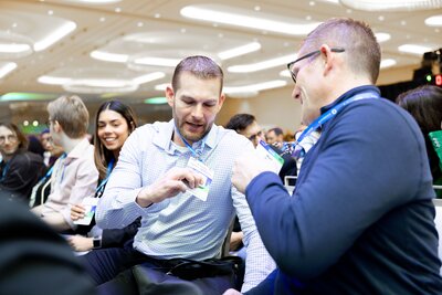 HumanX attendees scan their badges to network 