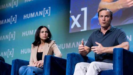 A networking meeting is happening in a private meeting space at the SolutionBridge floor at HumanX 2025